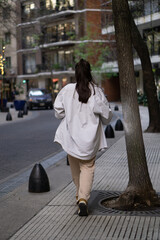 woman walking with a white shirt Buenos Aires, Argentina