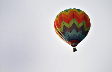Sunlight falling on hot air balloon in flight at afternoon