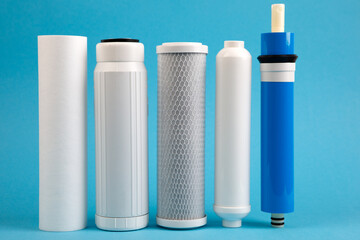 filter cartridges for water on a bright blue background.