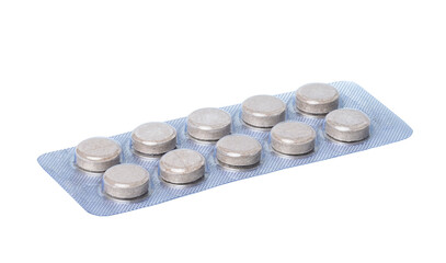 Obraz na płótnie Canvas Round pills in blister pack on a white background, close up