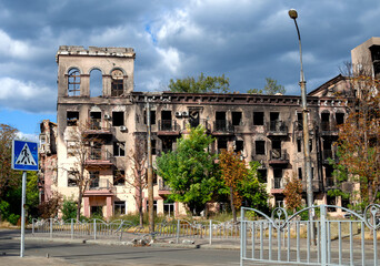 destroyed and burned houses in the city during the war in Ukraine