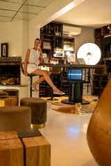 Girl playing with a cat in a bar