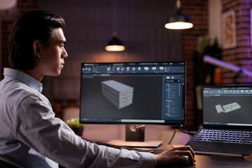Cad developer working on industrial manufacture of technical engine product with infographics...