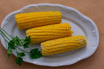 cooked corn on the cob on a plate