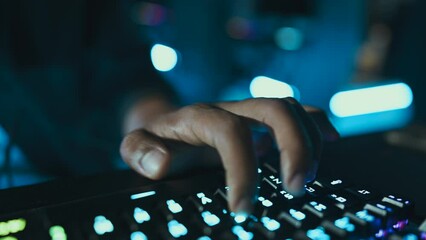 Gamer's hand on the keyboard.