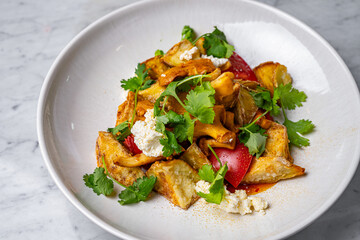 salad with mushrooms, tomatoes, cheese and herbs