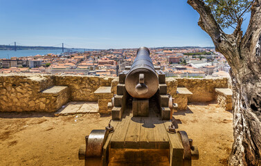 view of the city of lisbon under the sights of the cannon