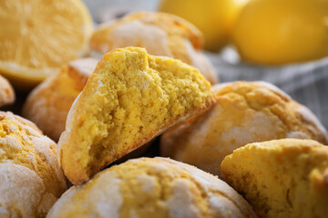 Many delicious lemon cookies on towel, closeup