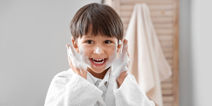 Cute little boy washing hands in bathroom - Powered by Adobe