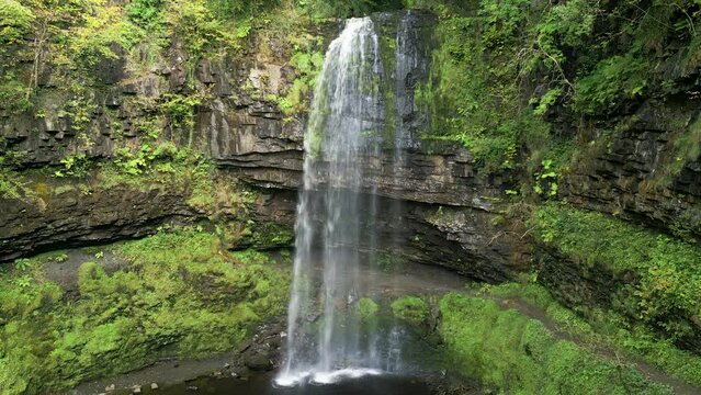 Aerial drone view of Henrhyd Falls - the tallest waterfall in the Brecon Beacons, Wales