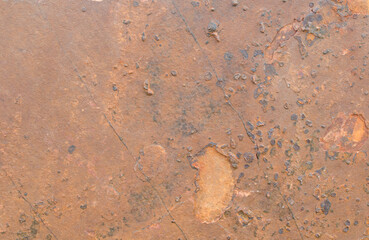 Rustic stone, stone wall erosion texture or grunge stone texture with rust color used for web design and wallpaper background.