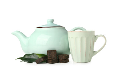 Dry pressed puer tea with leaves, cup and teapot on white background