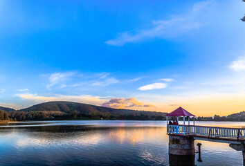 lake with mountains in the background, pier and sunset in the horizont, el oro de hidalgo mexico...