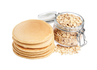 Tasty oatmeal pancakes and flakes on white background