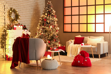Interior of living room with Santa bag, sofa and Christmas tree