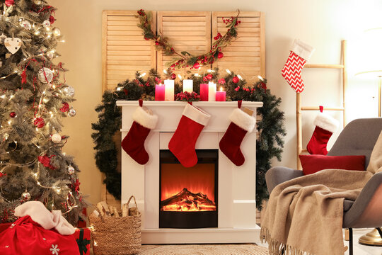 Interior of living room with fireplace and Christmas decor