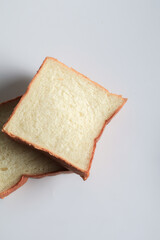 Homemade slide bread on white background. Morning breakfast concept. Fresh baked bread. Autumn tone color.