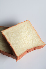 Homemade slide bread on white background. Morning breakfast concept. Fresh baked bread. Autumn tone color.