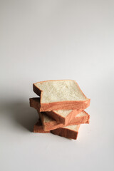 Homemade slide bread on white background. Morning breakfast concept. Fresh baked bread. Autumn tone color.