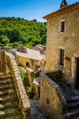 Narrow paved street and old houses in the medieval village of Saint Montan in the south of France (Ardeche)