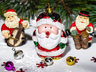 Santa Claus ornaments placed on the decorative table against festive background