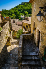 Narrow paved street and old houses in the medieval village of Saint Montan in the south of France (Ardeche)