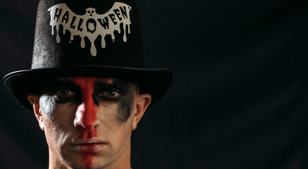 Halloween male. Halloween concept. portrait of a man in a hat. People. Background. Strong face. Evil. 