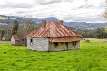 Fototapeta na wymiar View of an old abandoned farm house