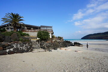 shoaling beach and seaside cafe