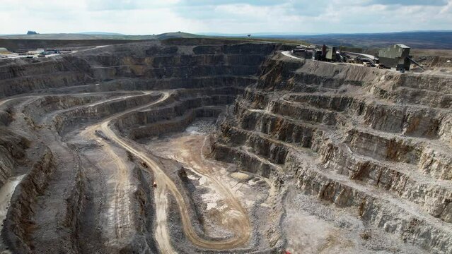 Hanson Aggregates Quarry Site At Daytime In Harrogate, North Yorkshire, England, UK. - aerial descend