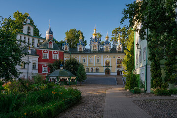Fototapeta premium View of the Assumption Cathedral, the Great Belfry and the sacristy in the Holy Dormition Pskov-Pechersk Monastery on a sunny summer day, Pechory, Pskov region, Russia
