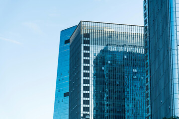 Fototapeta na wymiar Modern office buildings under blue sky