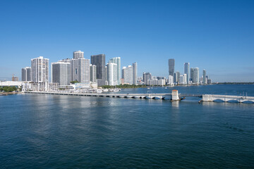 Fototapeta na wymiar Residential waterfront buildings on Biscayne Bay in Miami, Florida on clear calm sunny autumn morning..