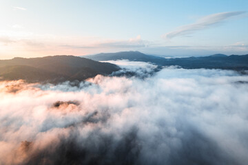 fog with mountains and light in the morning