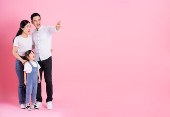 Fototapeta premium young asian family image isolated on pink background