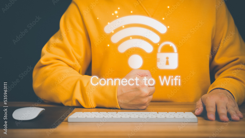 Aufkleber Man using a computer keyboard to connect to wifi and waiting to loading digital business data form website, concept technology of waiting for connect to wifi.