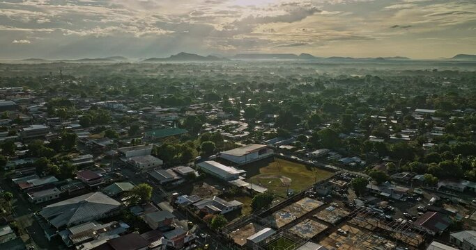 David Panama Aerial v17 sunrise view, drone flyover el carmen and el vedado neighborhoods capturing golden sunlight shinning across residential townscape - Shot with Mavic 3 Cine - April 2022