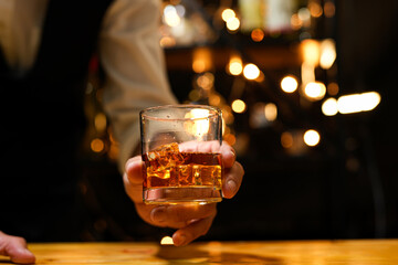 Bartender pouring Whiskey, on  bar,
