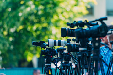 Cameras at a Media Conference