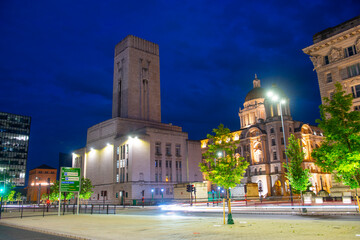 Fototapeta na wymiar George's Dock Building and Port of Liverpool Building at night at Strand Street on Pier Head in Liverpool, Merseyside, UK. Liverpool Maritime Mercantile City is a UNESCO World Heritage Site. 