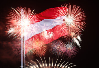 Austrian flag flutters on poles above the night sky and fireworks. austria independence