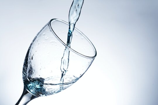 image of pouring water into a glass