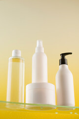 A set of different mockups with a cosmetic product on a glass shelf. Skin care. Template for logo design