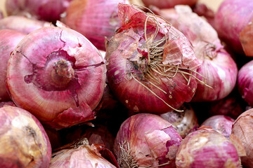 Red onions in plenty on display at local farmer's market, Big fresh red onions background