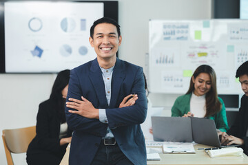 Close-up shot of a man meeting in a startup company meeting room, he is a marketing worker attending meetings with executives and employees to plan a sales boost. Sales management concept.