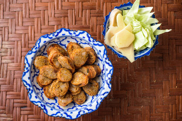 Notrhern thai spicy sausage on the porcelain product.