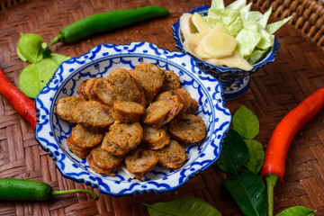 Notrhern thai spicy sausage on the porcelain product.