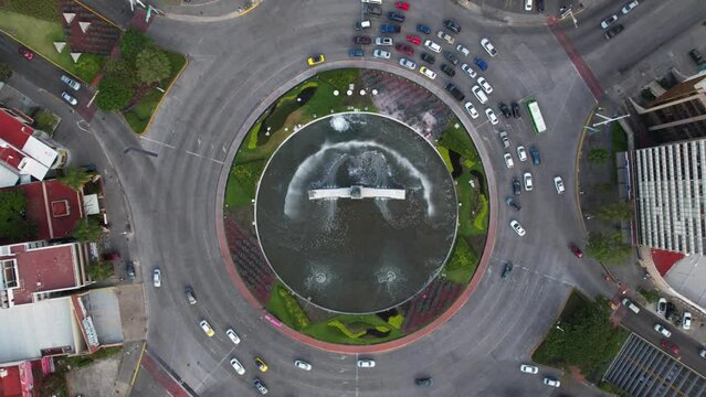 Drone hyperlapse above traffic at a Roundabout, in Guadalajara, Mexico - top down, Aerial