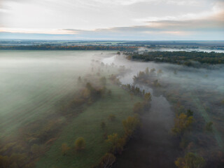 foggy river in autumn at dawn aerial photo