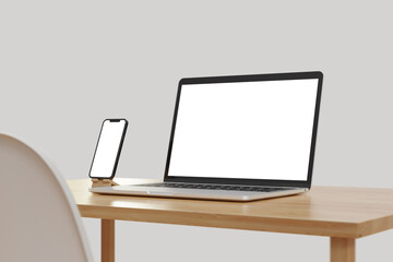 Smartphone and laptop on the tablet